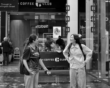 Two friends happily sharing a story caught by the lens of Peter Pickering