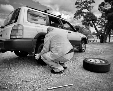 Man changing car wheel