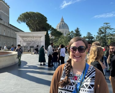 Cassie standing in front of St. Peter's Basilica