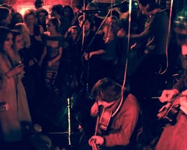 Crowd at a busy Cool For Cats Live gig during an earlier run of shows, showing a packed live music v