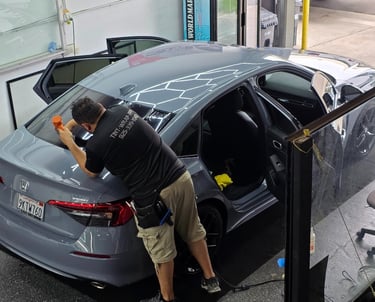 Ceramic window tint installation on a black luxury sedan in Livermore CA
