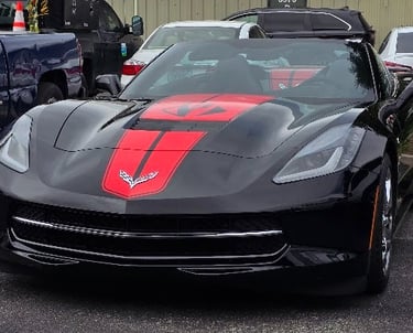 Black Corvette Stingray with red racing stripe installed in Livermore, California.