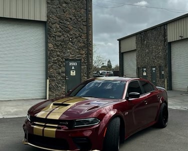 Custom matte metallic burgundy Dodge Charger with gold racing stripe and accents in Livermore, CA.