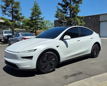 Ceramic window tint installation on a white tesla in Livermore