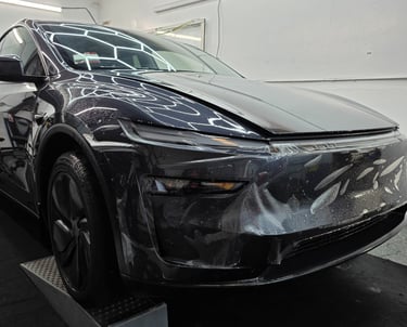 Work-in-progress installation of ppf film on the tesla's front bumper by Bluemax tint in Livermore