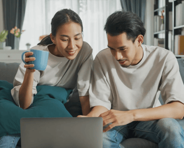 A couple looking at health resources on the computer.