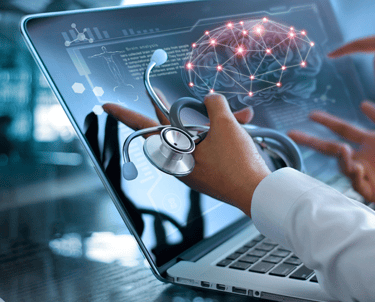 Doctor pointing at a WAVi brain scan on a computer