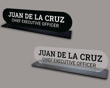 2 desk name plates with black and clear acrylic with the name Juan Del La Cruz
