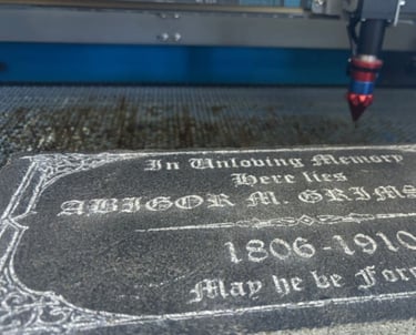 Granite engraved with text using a laser cutter