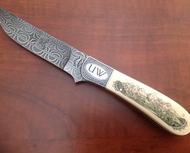 a custom engraved knife on a table