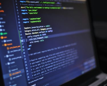 a laptop computer screen displaying a program to write a program