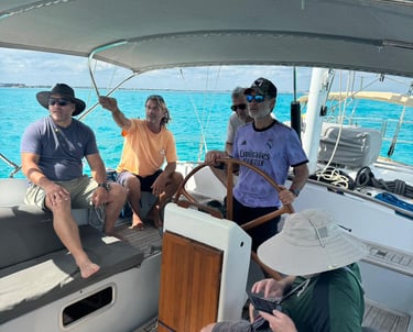a group of people on a sailing course in Cancun in a sailboat cancun