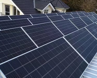 Residential rooftop solar panel installation for clean renewable energy on a modern home.