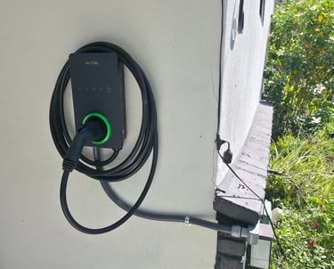 Autel wall-mounted electric vehicle charging station with cable installed on a residential exterior wall.