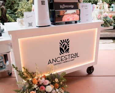 Full view of Ancestral on Wheels espresso cart with custom branding for events