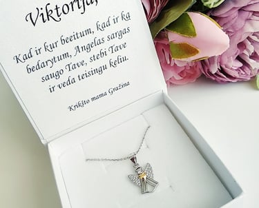 a white box with a silver cross on it