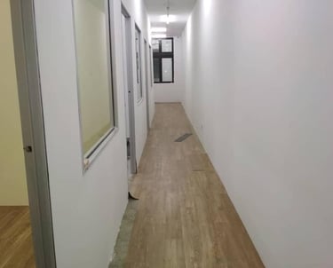 Suasana Renovations office corridor interior design, flooring, and partition work.