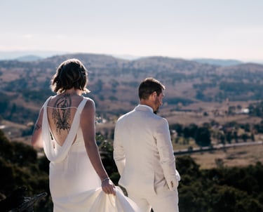 Bride and groom facing away from camera during first look, overlooking canberra hills. Wedding day captured by Canberra photo