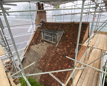 Inside a temporary roof scaffolding fully encapsulated on listed building