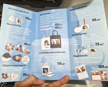 a person holding a book with pictures of a person holding a bag