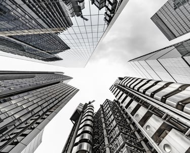 a cityscape of tall buildings with a sky view of the city