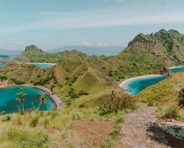 Top view of Padar Island, Komodo National Park, showing turquoise bays and rugged island hills