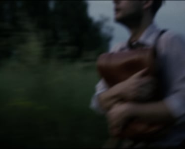 a man in a leather vest with a leather vest