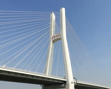 A sleek high-speed train gliding along newly constructed tracks through a vibrant countryside.