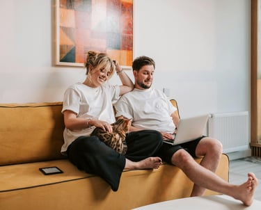 a man and woman sitting on a couch