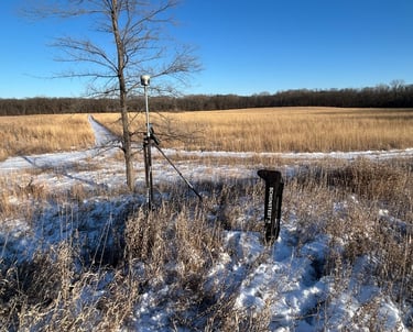 Trimble R12i with TSC7 in the winter overlooking prarie