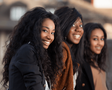 Smiling faces of diversity in the energizeHER Village for Girls membership