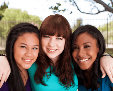 Smiling faces of diversity in the energizeHER Village for Girls membership