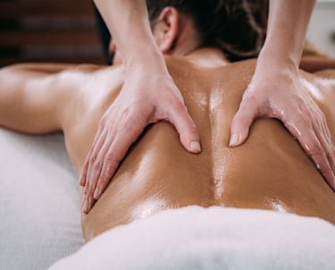 a woman getting a massage at a spa