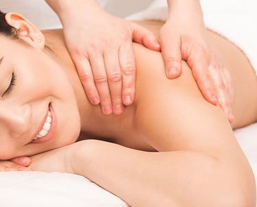 a woman is getting a massage at a massager