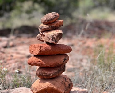 A real red rock stone cairn of 8-10 inches in the Sedona desert