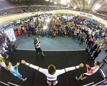 a man celebrating after wining a medal at a major championships