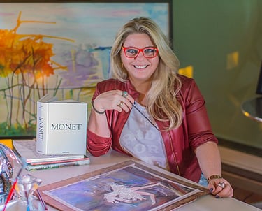 a woman sitting at a desk with a book and a book