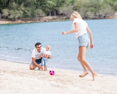 Family playing with baby on beach during Koh Samui photoshoot