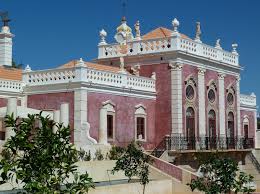 a large building with a lot of windows and a lot of trees