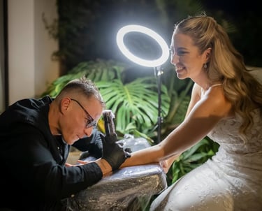 Cuart Ink providing a live wedding tattoo experience for a bride in marbella villa