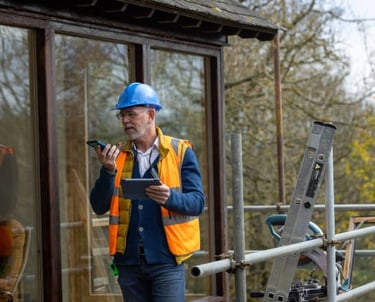 Contractor on-site with a tablet or phone