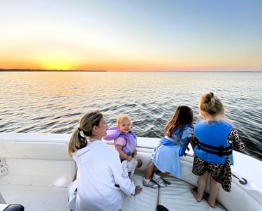 Family enjoying sunset dolphin tours in santa rosa beach.