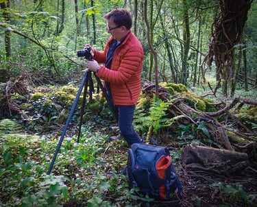 Paul Binnion Nottingham Photographer setting up his camera in the woods