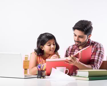 a man and a little girl are sitting at a table