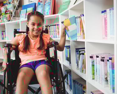 a girl in a wheelchair wheel chair in a library