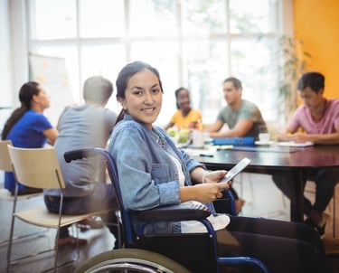 a woman in a wheelchair wheel chair in a room