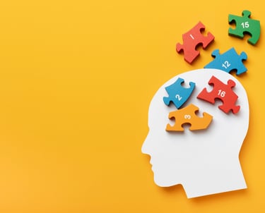 a person's head with puzzle pieces of puzzle pieces of puzzle pieces of puzzle