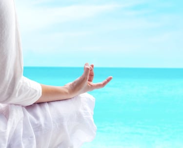 a person sitting on a bench with their hands up