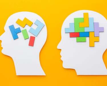 two pieces of paper cutouts of a head and a head of a person '