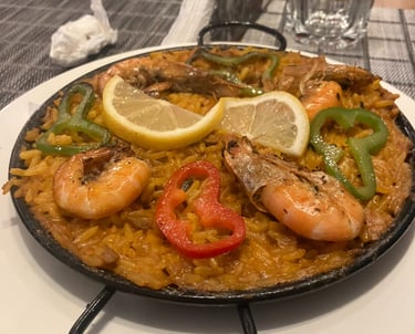 a pan of food with a lemon slice on top of it - halal food 